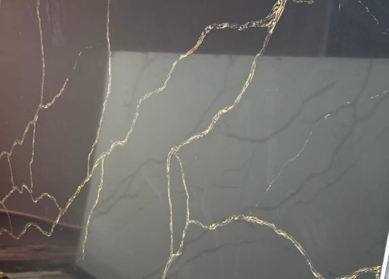 Close-up of cracked glass or surface with branching fracture patterns and light reflection